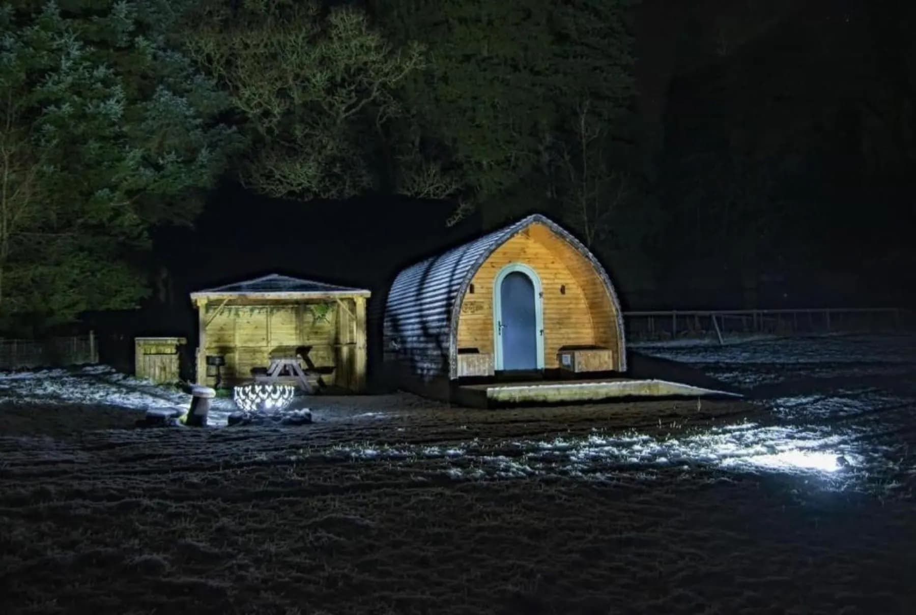 A cabin lit against a frosty night