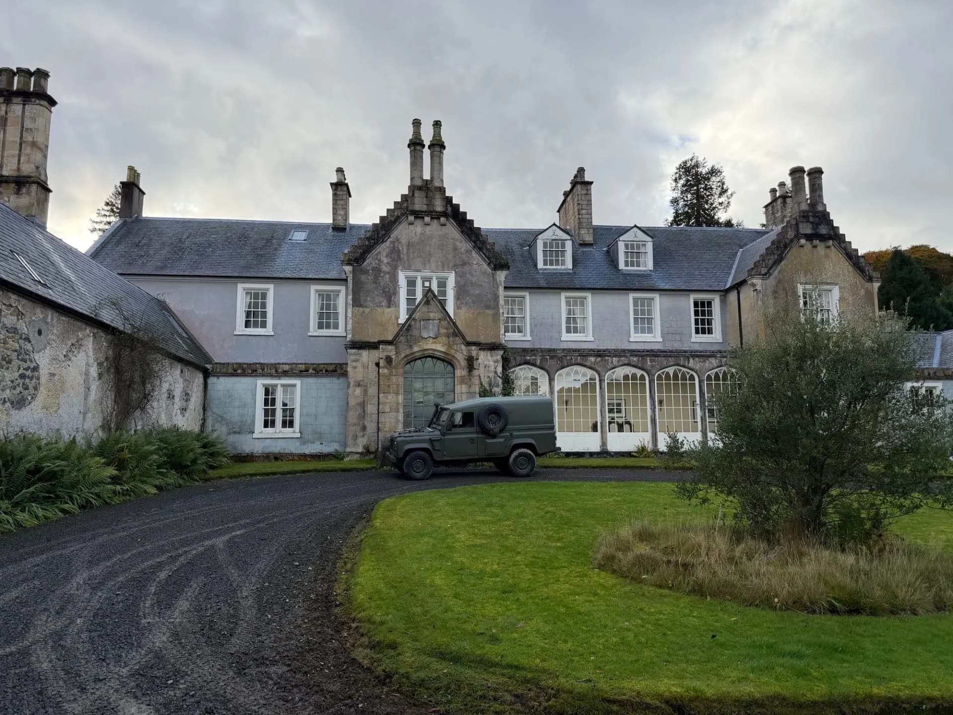 Craigengillan House beneath a dramatic sky